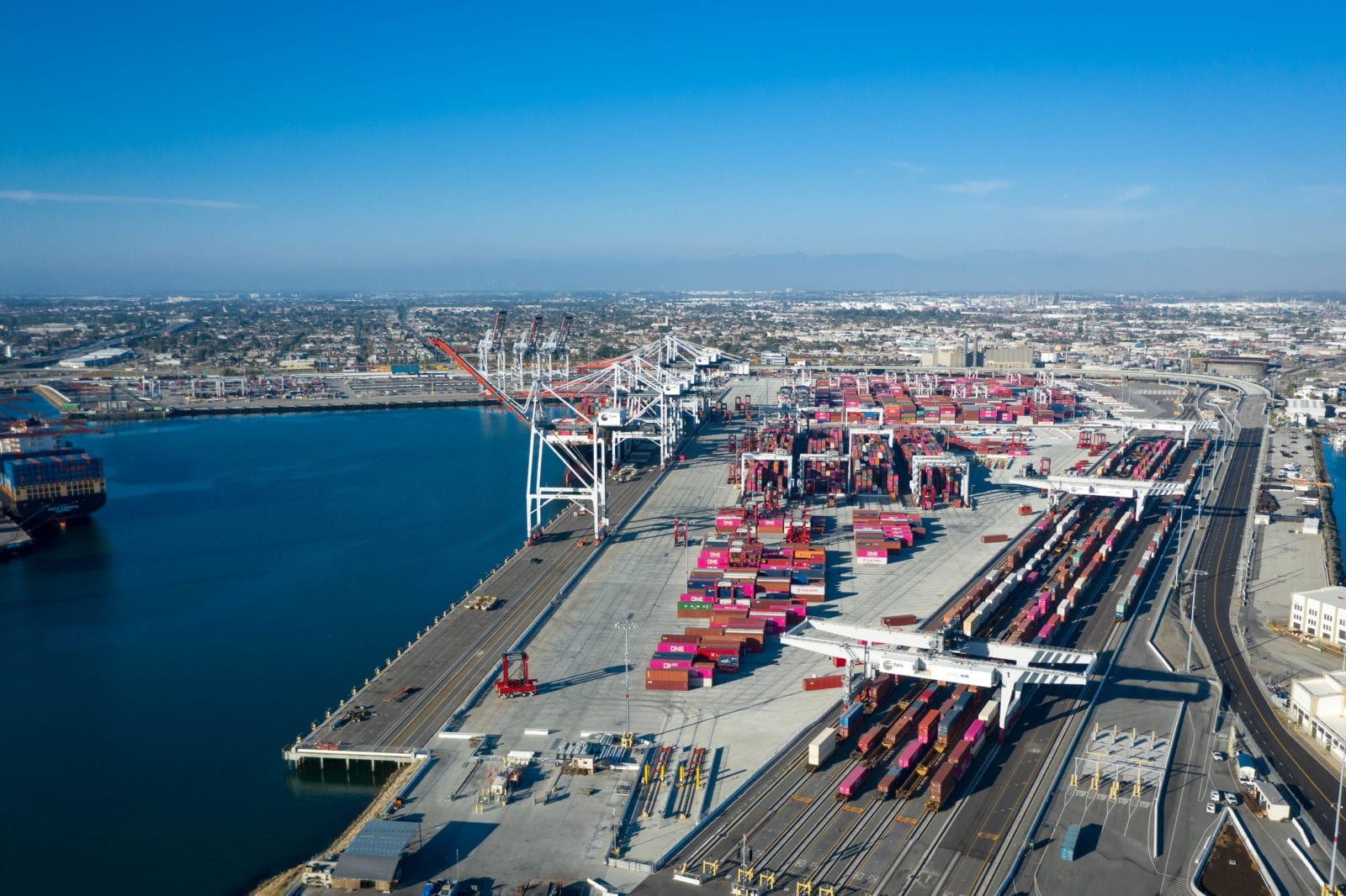 busy container terminal operations showing manual processes, complex logistics coordination